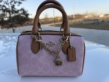 Coach Mini Rowan Crossbody Bag In Signature Canvas With Charms, Powder Pink