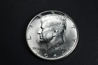 1964 D Kennedy half dollar AU 90% Silver at Spot Price.
