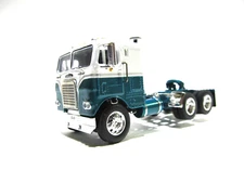 DCP FIRST GEAR 1/64 SCALE FREIGHTLINER CABOVER, WHITE & TURQUOISE, GRAY STRIPE