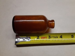 Vintage amber glass apothecary medicine bottle