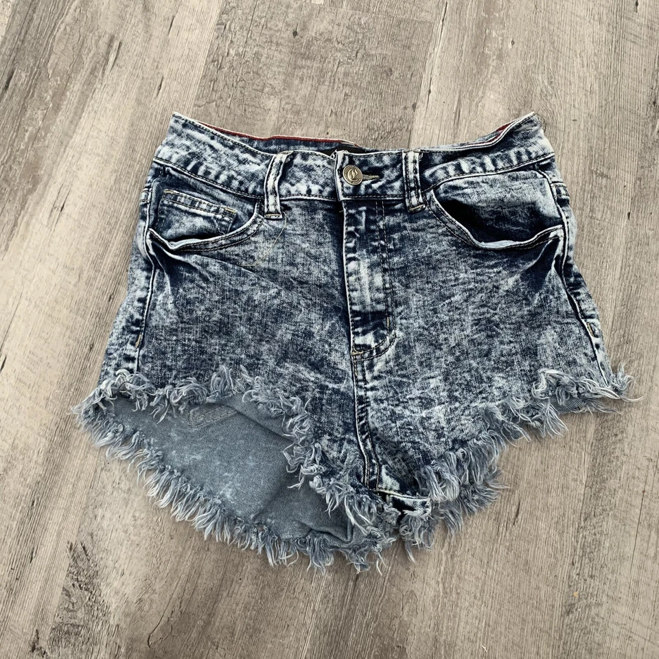 Pantalones cortos de mezclilla para violonchelo para mujer pequeños corte lavado con ácido tiro alto dobladillo crudo elástico Foto 3 de 4