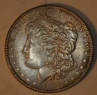1886 P Morgan Silver Dollar AU. BLB9