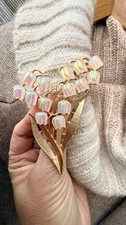 Enchanting iridescent lily of the valley brooch with gold-tone stems