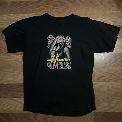 In prep for March 24, we got the tee your younger self would’ve begged for 🎤, Hannah Montana turns 20 on Disney and Zara just dropped a collab with Disney., #ahlanlive #hannahmontana