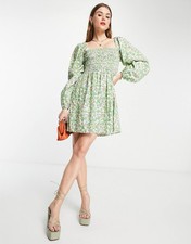 Robe smockée fleurie en coton bio Envii manches ballon vert coquelicot...