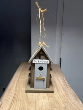 Birdhouse Vintage With Outhouse And Flower Baskets On Sides