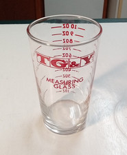 Vintage TG & Y Measuring Glass Cup Ounces Milliliters Red Lettering