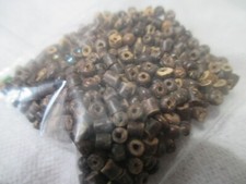 A FEW HUNDRED BROWN WOOD-LOOK BEADS 2MM-4MM LONG, 2MM WIDE to make jewelry