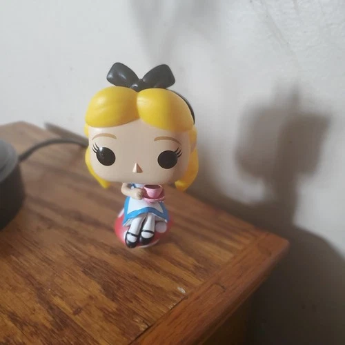 Alice Funko from Alice In Wonderland Holding Tecup,sitting On Mushroom No Box