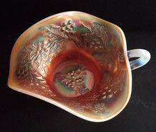 Dugan Carnival Glass Peach Opalescent Holly and Berry Handled Nappy Bowl