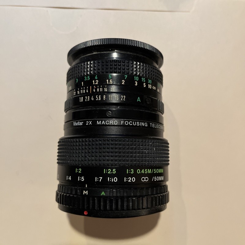 Canon lens 50 mm 1.8–22 and Vivitar 2-X macro telegram converter