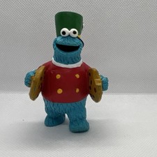 Applause Cookie Monster Sesame Street Figurine with cookie cymbals.