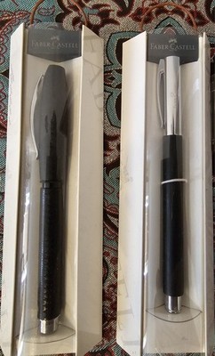 2 Faber-Castell fountain pens one with leather handle,,black brand new and unused