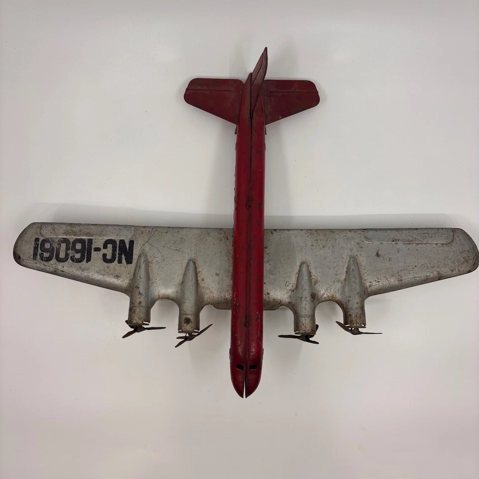 Vintage Wyandotte Pressed Steel Airplane Toy 4-Engine Airliner Red & Silver NC-1 - Image 4 of 4