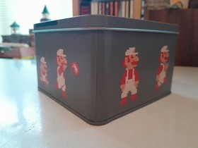 Super Mario Bros Jigsaw in a collectable Nes Cartridge style metal tin. Nintendo