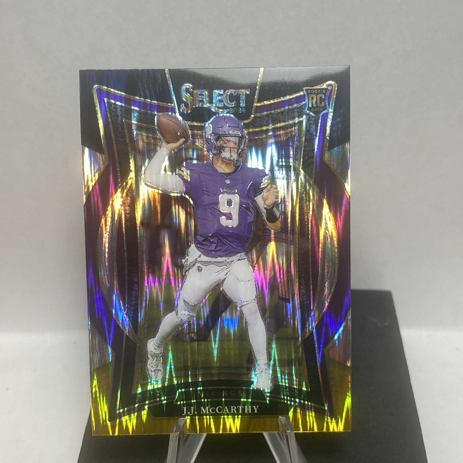 2024 Panini Select J.J. JJ McCarthy Concourse Black and Gold Prizm Shock Vikings