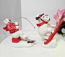 2- 1995 Enesco Ceramic Coca Cola Polar Bear Ice Fishing & Snowboarding Figurine