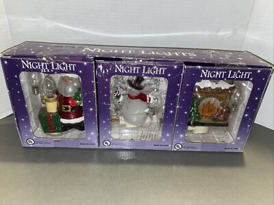 3x- Santa clause/Snowman & Fireplace night lights w/extra bulbs From Costco New