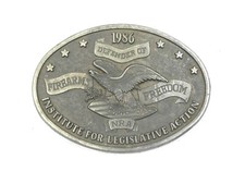 VINTAGE USED 1986 NRA DEFENDER OF FIREARMS FREEDOM BELT BUCKLE WITH USAGE WEAR