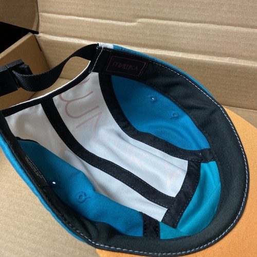 MNWKA 5 panel hat with teal, blue, and white color block design, black stitching, and front logo patch.