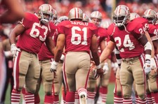 Jesse Sapolu San Francisco 49ers is greeted by teammates including- Old Photo