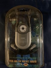 Mini radio portable de poche AM/FM COBY CX-7 avec sangle de cou grise ceinture intégrée