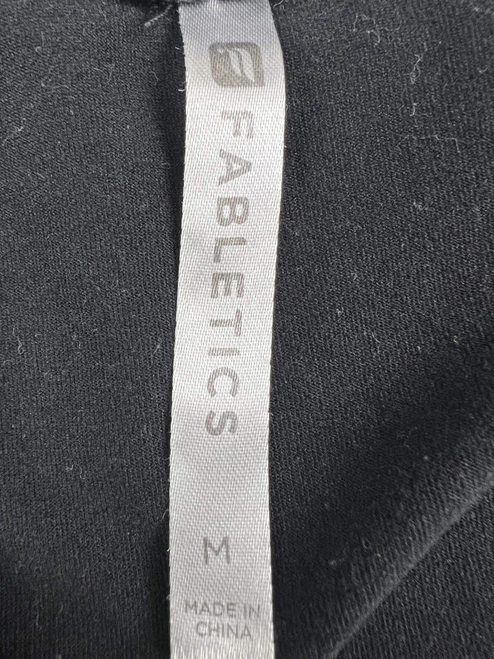 Chaqueta activa negra para mujer Fabletics bolsillos con cremallera talla mediana Foto 4 de 4