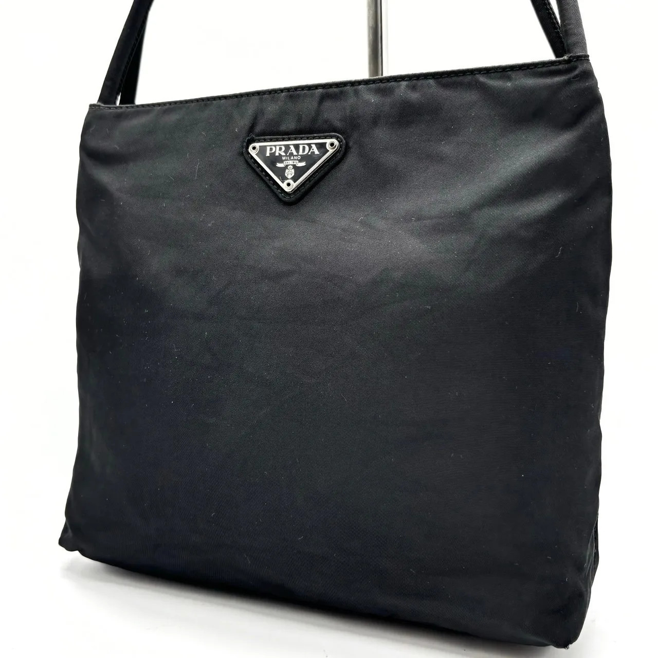 Prada black nylon tote bag with silver triangular logo plate from Japan