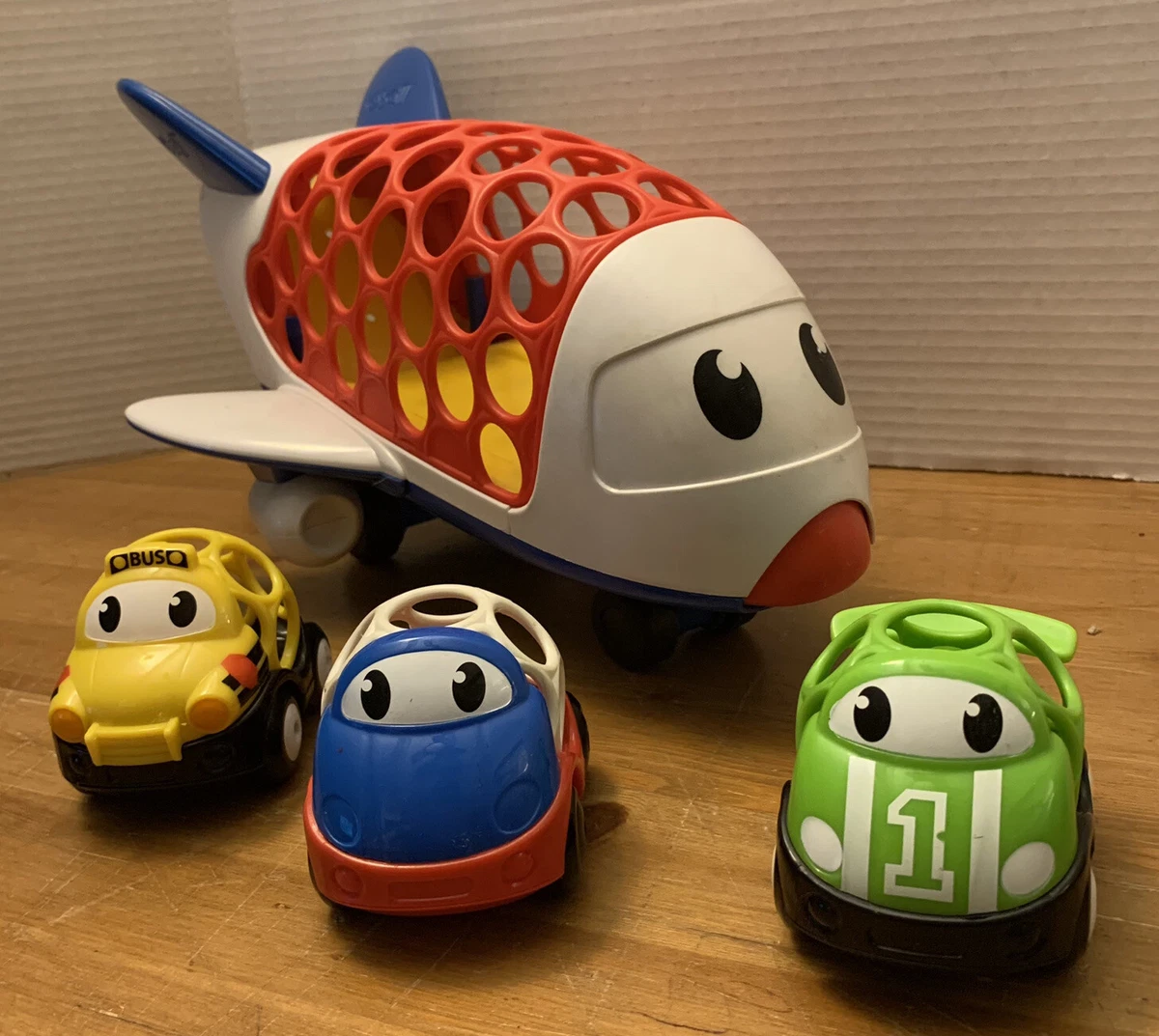 Kids II Oball Lot of 4 Infant Developmental Easy Grasp Toys Air Plane Cars