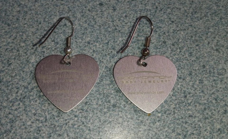 Pendientes perforados Body Candy marca lobo.Azul y tostado.Nunca usados Foto 3 de 3