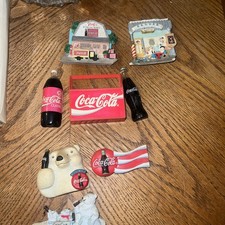 A lot of vintage Coca-Cola refrigerator magnets