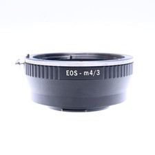 Adattatore obiettivo Canon Eos EF a Olympus Micro quattro terzi M4/3