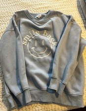 Women’s Le Lis Light Blue Sweatshirt With Embroidered Smiley Face. Size Small.