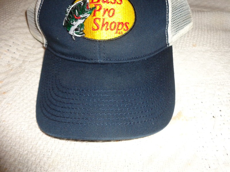 bass pro shop ball cap black front white mesh back sweat marks on bill.