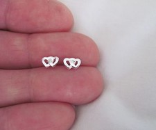 Sterling Silver 5mm tiny linked hearts post stud earrings.