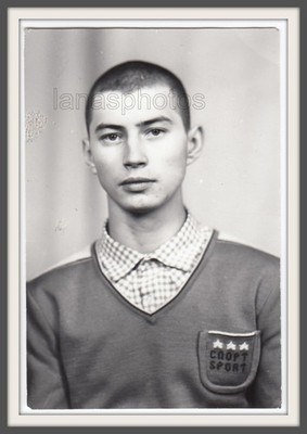 Handsome young man boy teen Sports sweater Interesting manly face Russian photo