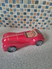 UNUSUAL TIN MODEL RACING CAR EMPTY BISCUIT TIN ..RED WHEELS MOVE