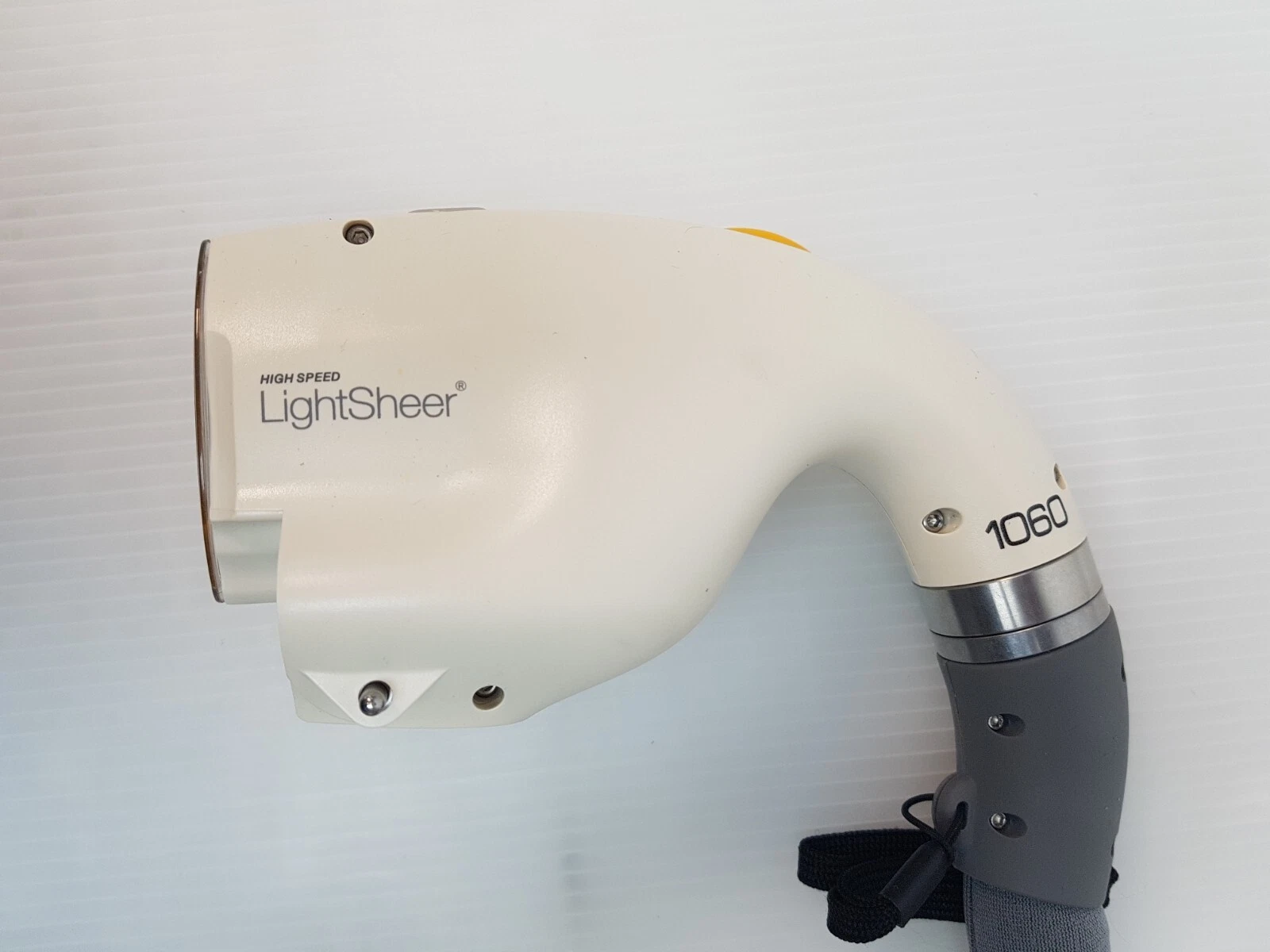 HIGH SPEED LightSheer handpiece head marked 1060, side view