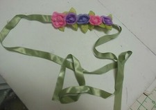 lot of floral accessories and extra beribboned flowers pastel lilacs pinks sage