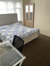 king size bed frame with a mattress and headrest. cream. used good condition.