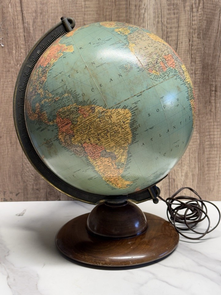 A 1949 Replogle Precision illuminated globe that still WORKS — warm glowing light through vintage cartography is pure mid-century magic.