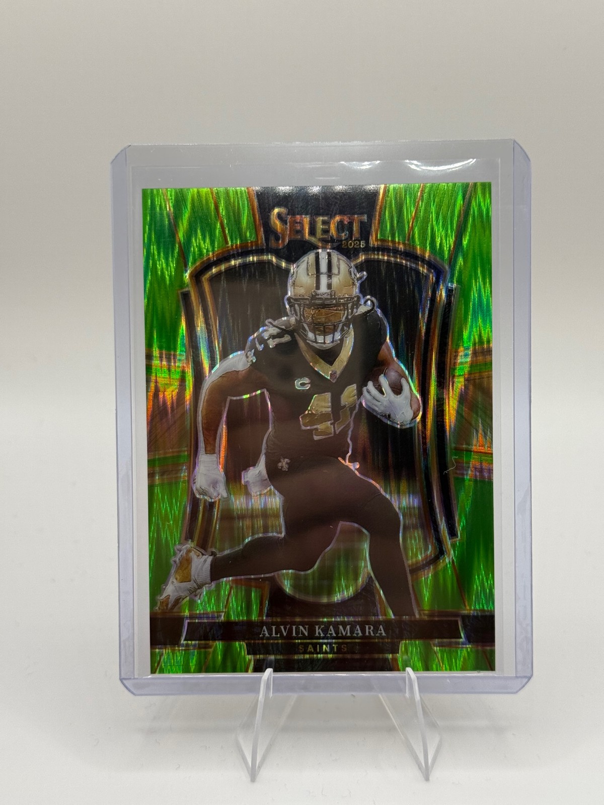 2025 Panini Select #140 Alvin Kamara Neon Green Prizm Shock #/699