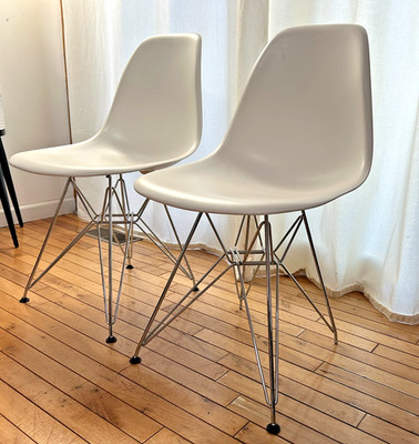 Pair of Eames molded plastic  wire base chairs Made by VITRA