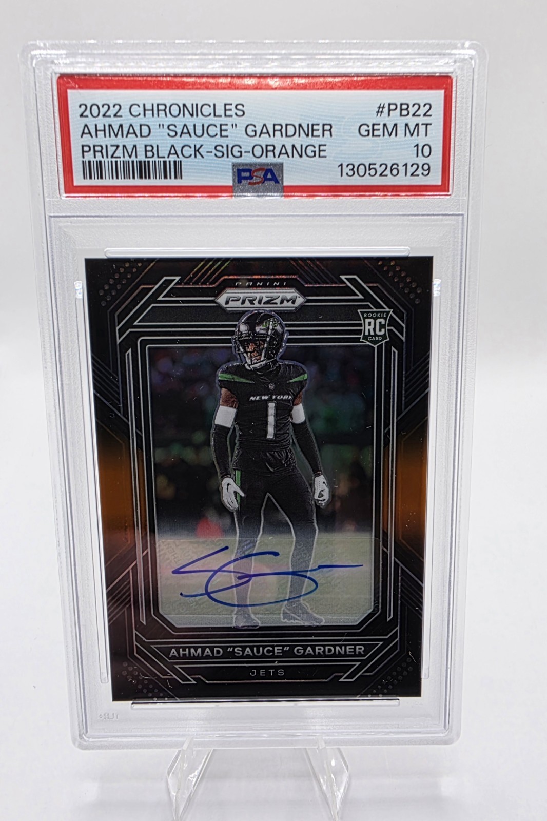 2022 Panini Chronicles Ahmad “Sauce” Gardner Prizm Black Orange Auto /75 PSA 10