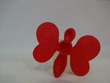 Altes Spielzeug / Roter Schmetterling