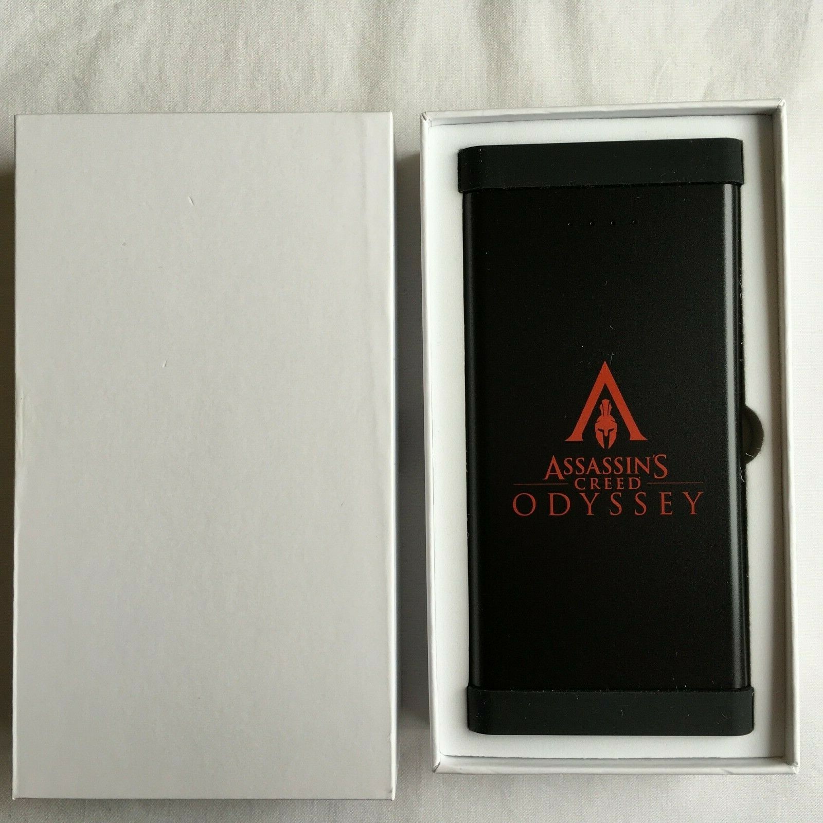 Assassin's Creed Odyssey Power Bank Promo Prensa Coleccionista Oficial "NUEVO" RARO