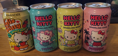 (4) Various Hello Kitty Collectible Soda Cans (FULL)