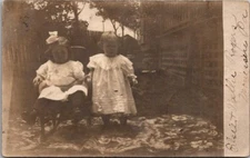 Black and White RPPC Postcard Children Sitting Outside