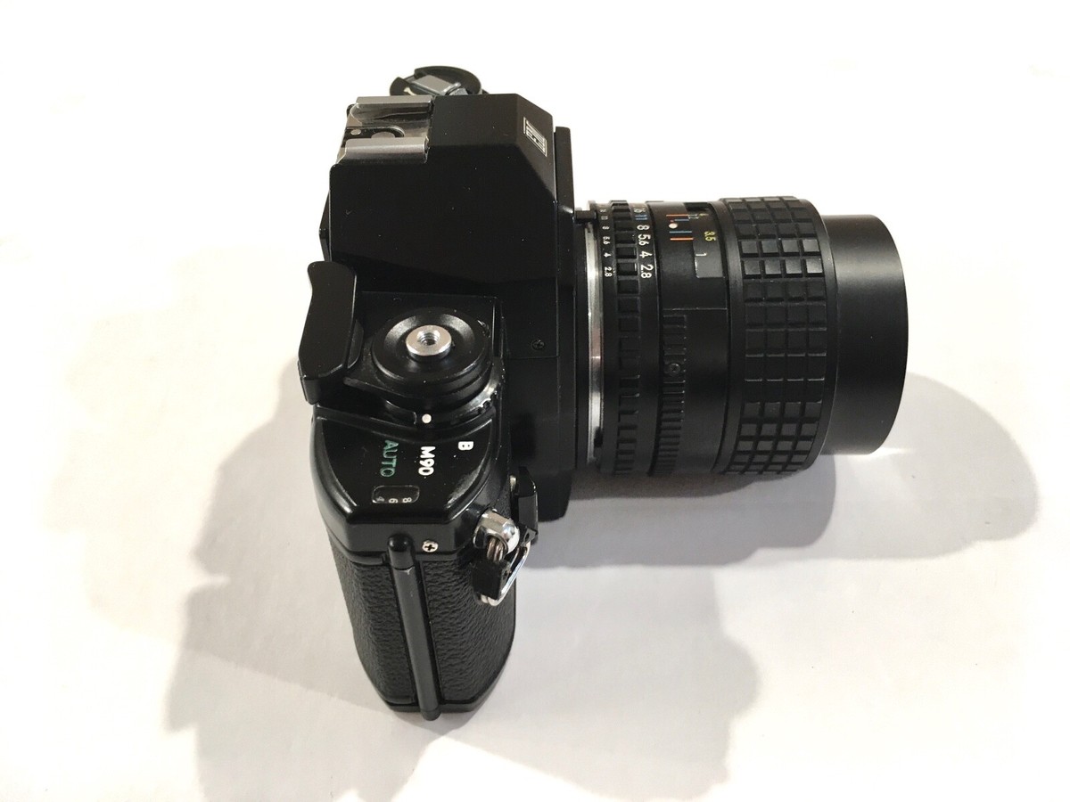 Nikon EM SLR Camera with Nikon Series E 100mm 1:2.8 lens and