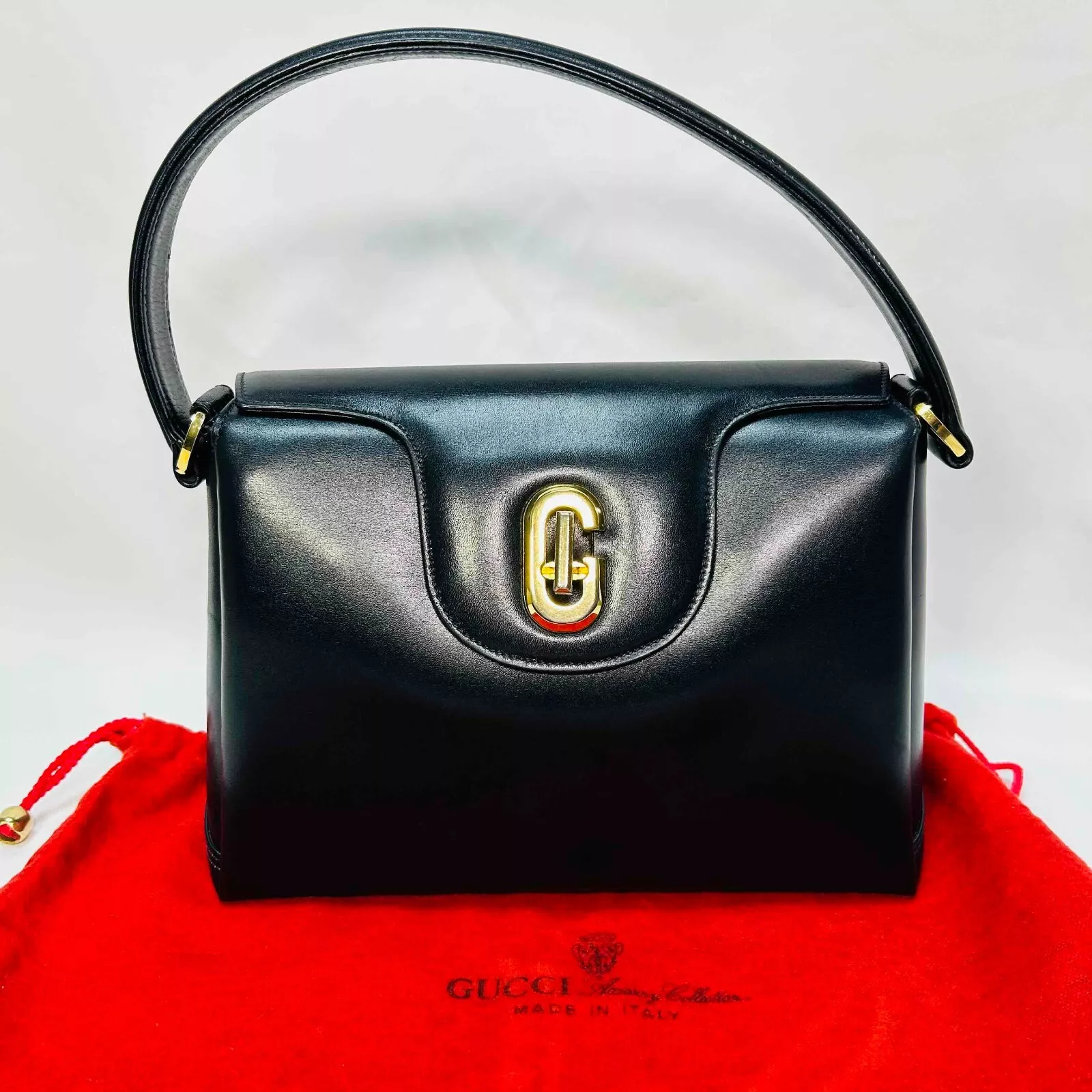 Sac à main bandoulière vintage GUCCI cuir bleu marine foncé garnitures dorées authentique